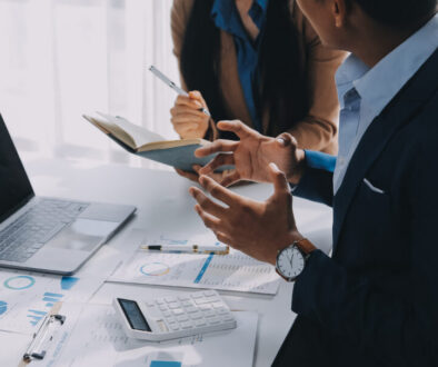 Business team working with new startup project plan and discussion information for financial strategy with laptop and digital tablet in a modern business lounge.